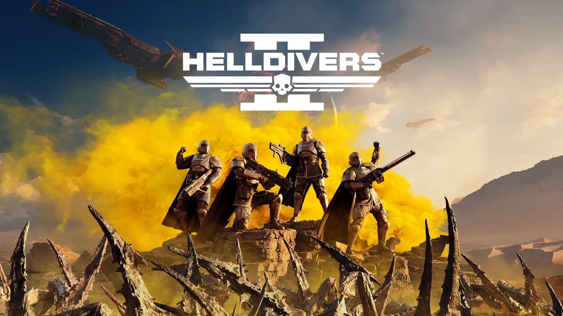 The Helldivers 2 logo displayed above a squad of Helldivers stand on a cliff, overlooking a desert scene